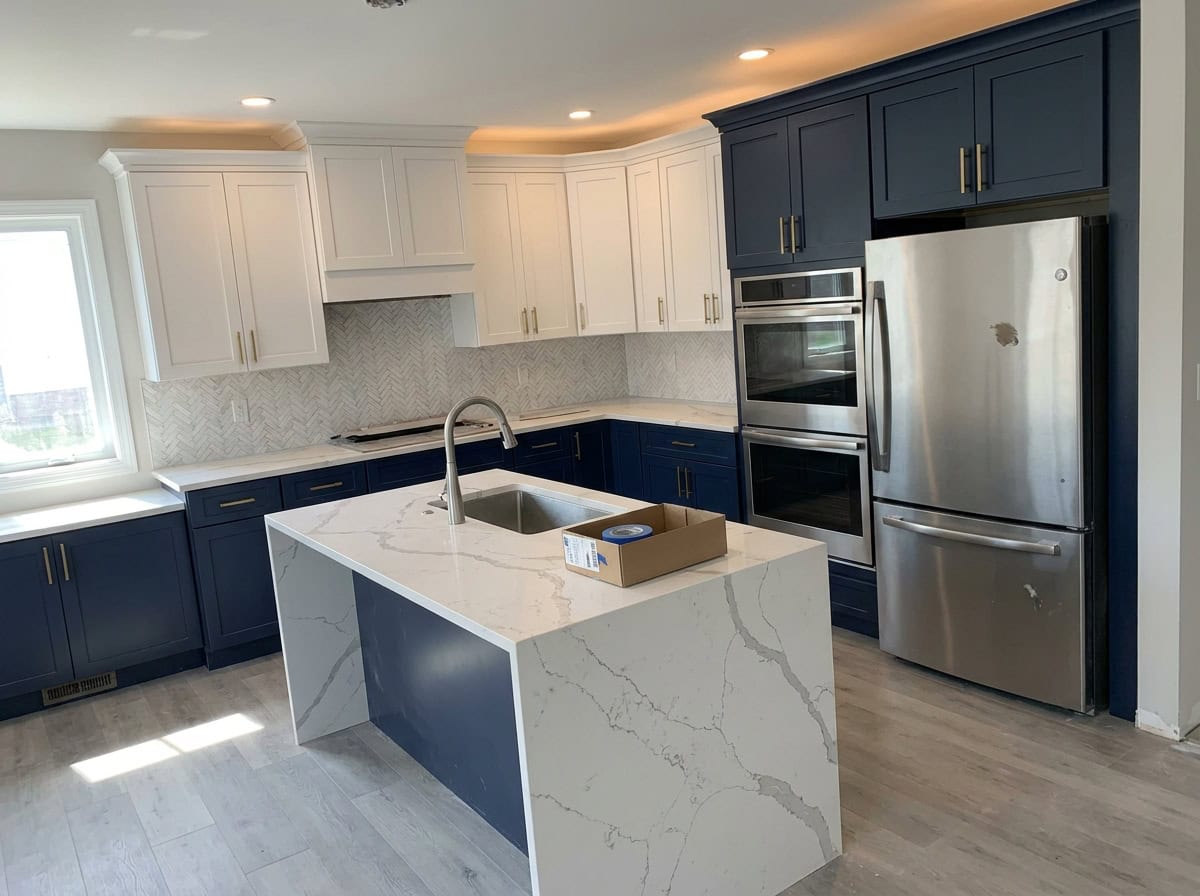 Navy and white two-tone kitchen renovation with gold hardware, Austin TX