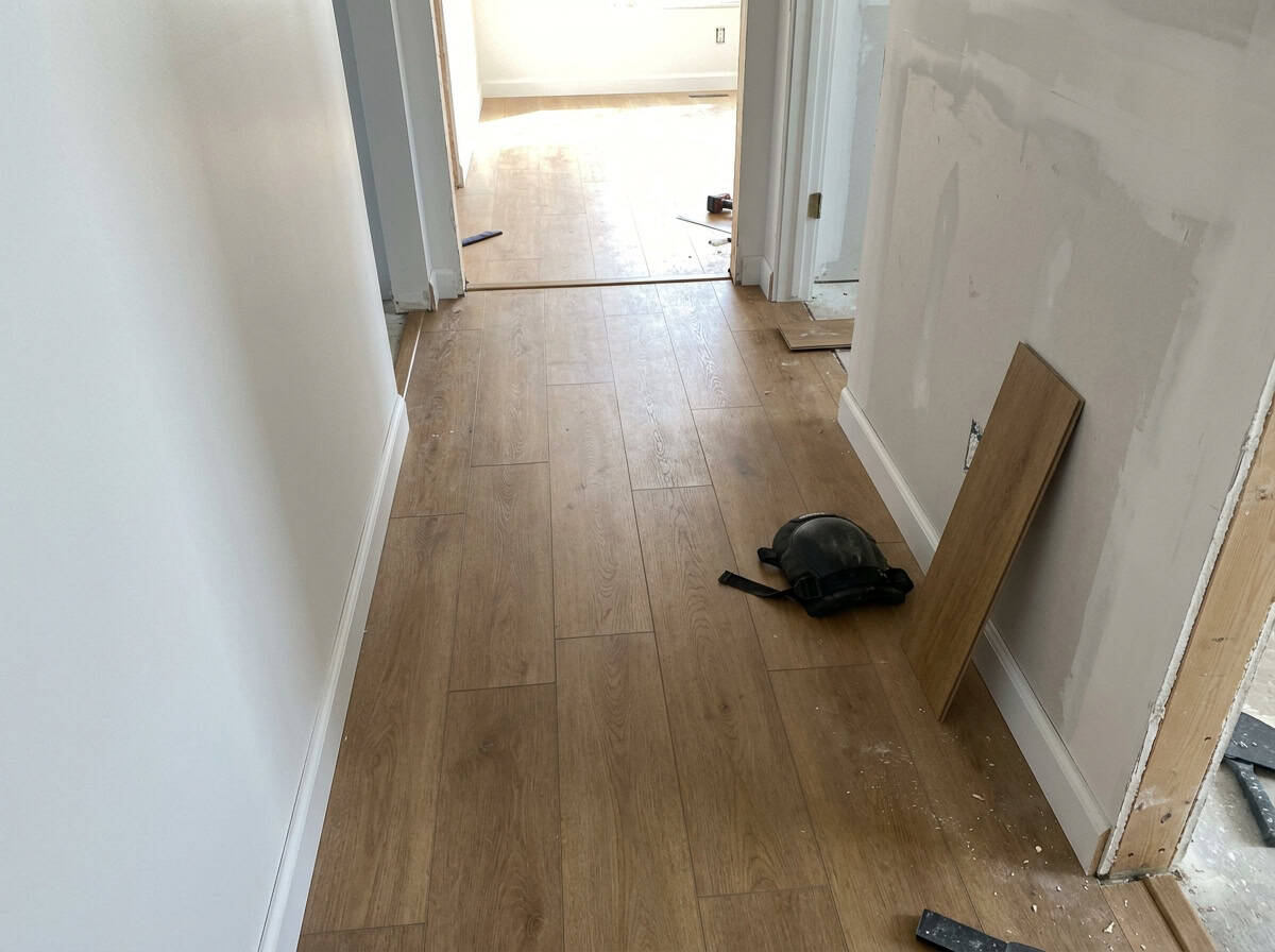 New LVP flooring installation in residential hallway, Austin TX